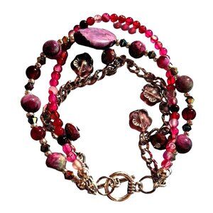 3 strand bracelet with a purple focal and fancy pink sapphire beads chains